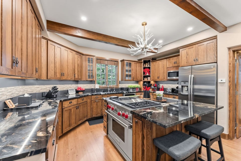 Kitchen: Drip coffee maker, Crockpot, blender, toaster, cooking utensils, tableware