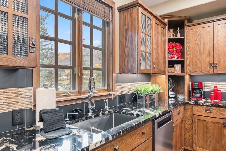 Kitchen: Drip coffee maker, Crockpot, blender, toaster, cooking utensils, tableware
