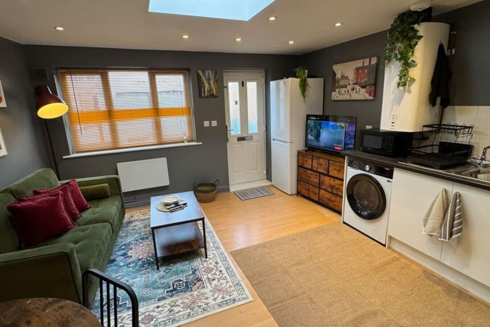 Kitchen and lounge with natural light from skylight