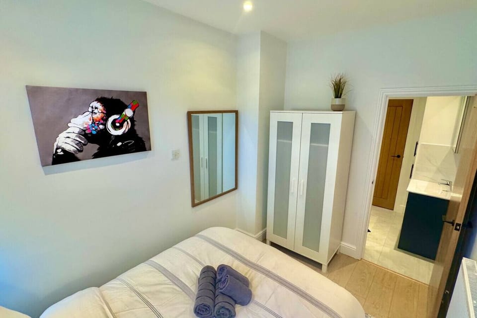 Bedroom with ample storage and soft lighting