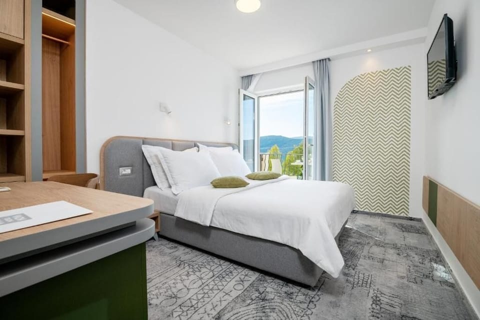 Deluxe Double or Twin Room, Balcony, Sea View | In-room safe, desk, laptop workspace, soundproofing