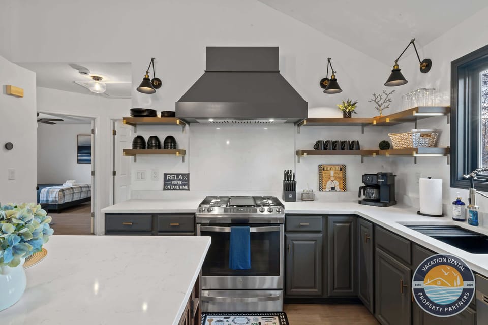 Bright kitchen with coffee bar and modern appliances - gather here for morning coffee and meal preparation together