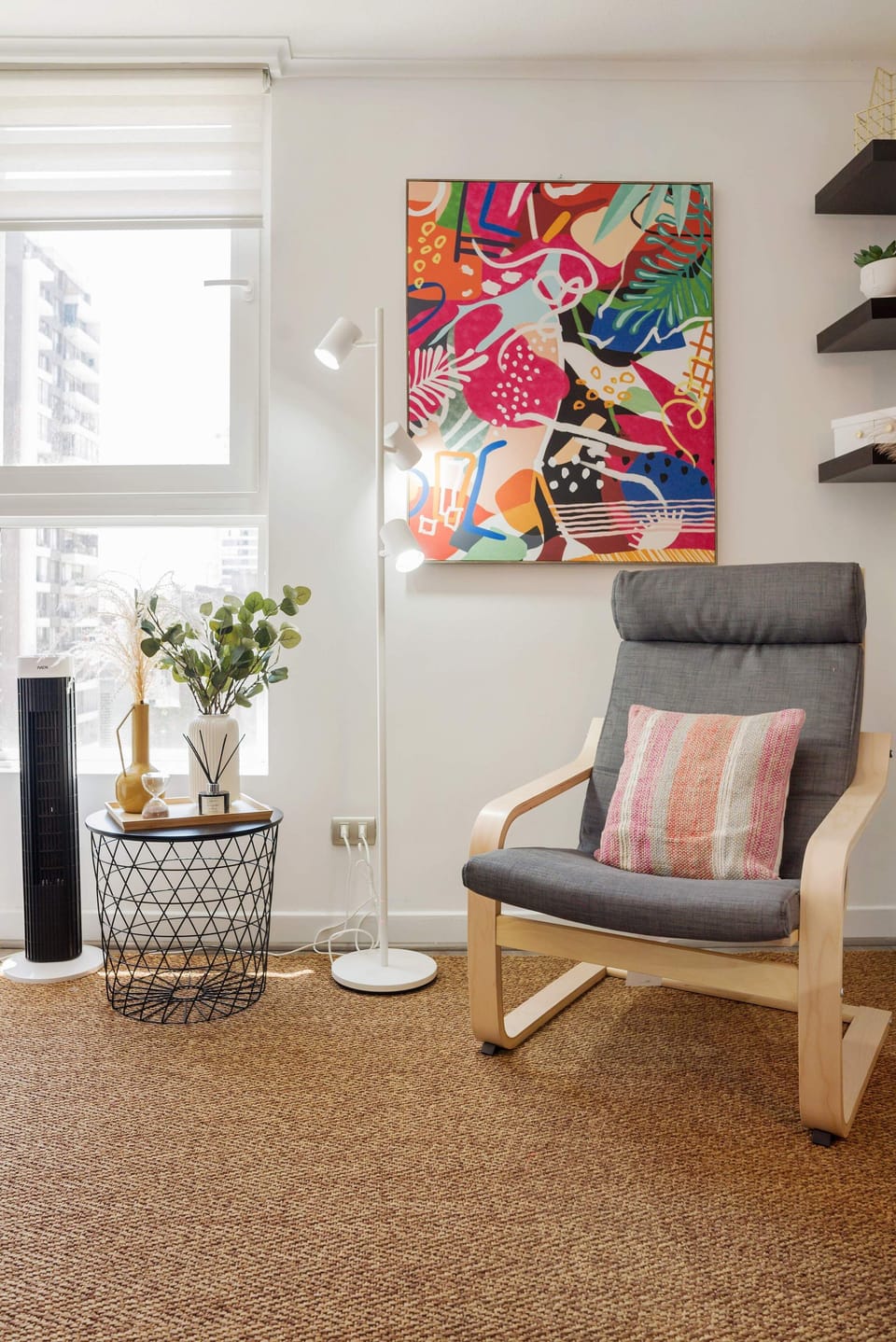 Relax in this stylish corner with vibrant art and city views, perfect for unwinding after a day of exploring.