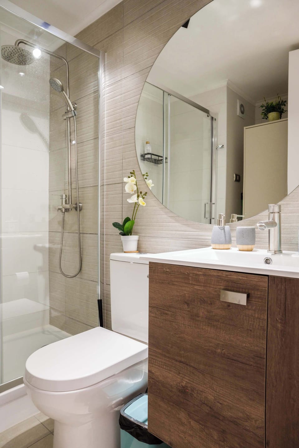 Modern bathroom with sleek fixtures and a spacious shower, perfect for a refreshing start to your day.