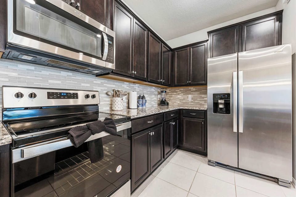 Cook with ease using stainless-steel appliances and spacious countertops.