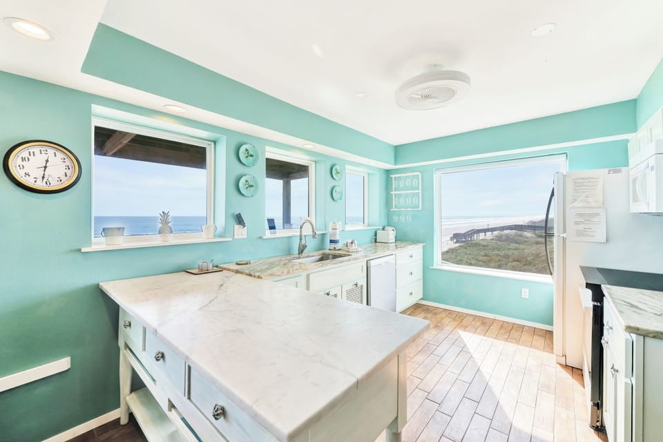 Your dream kitchen awaits with stunning ocean views and coastal charm. Cook with panoramic water vistas through every window.