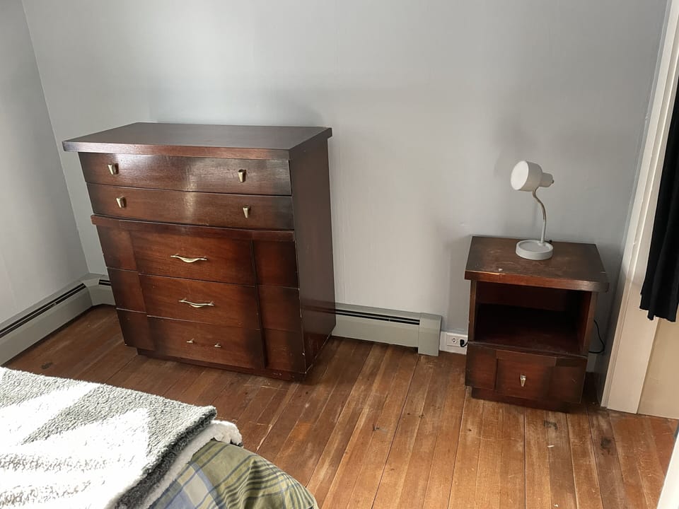 bedroom bureau and night stand, closet to the right