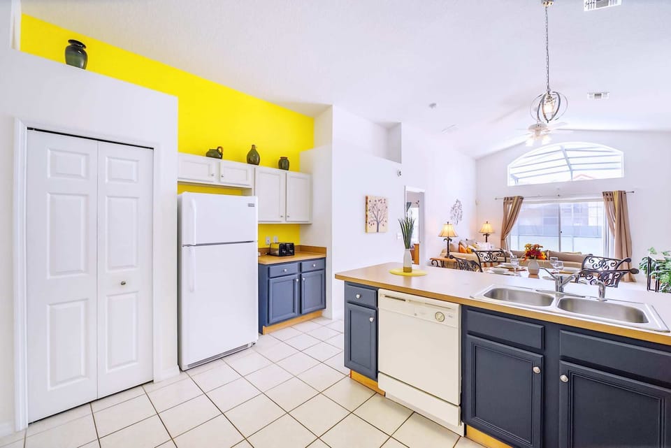 Stylish Kitchen Design With Contrasting Cabinetry And Natural Light