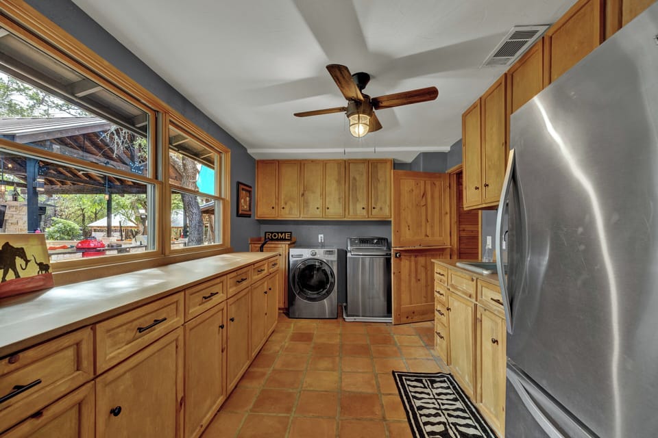 Fully-equipped kitchen with a laundry area provided for your convenience. 