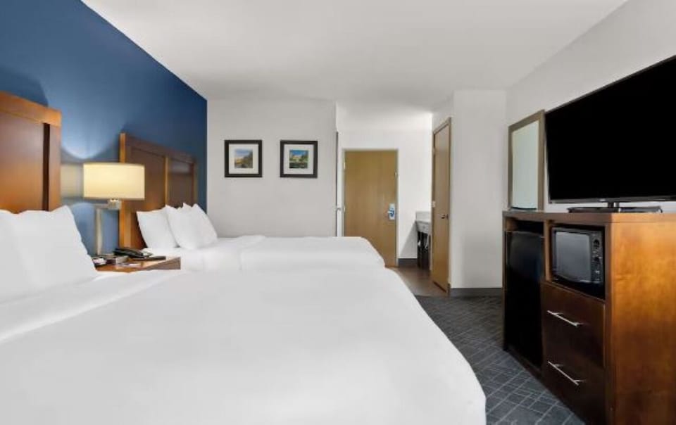 Stretch out with extra space, seating, and soft bedside glow.