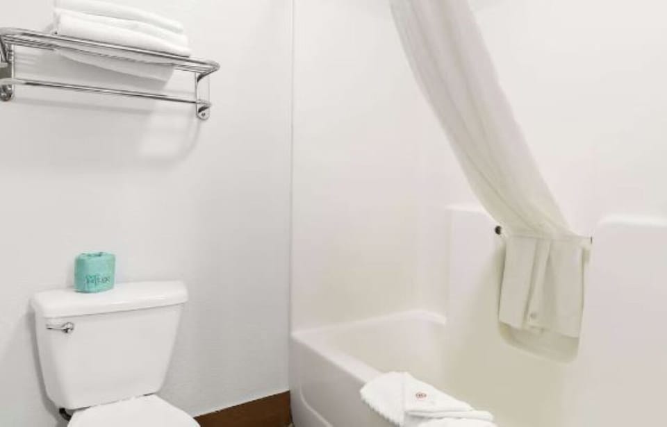 Refresh easily with spotless tub-shower and fluffy towels ready.