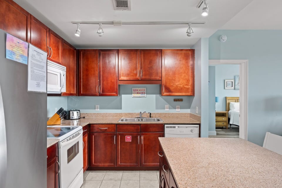 kitchen with cherry wood cabinets and modern appliances