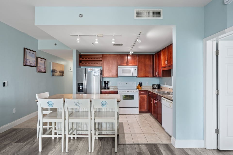 Modern kitchen with wooden cabinets and a breakfast bar for casual dining