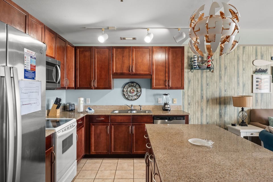modern kitchen with granite countertops and stainless steel appliances