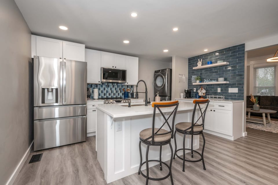 The chic, open kitchen offers ample space & all the comforts of home​