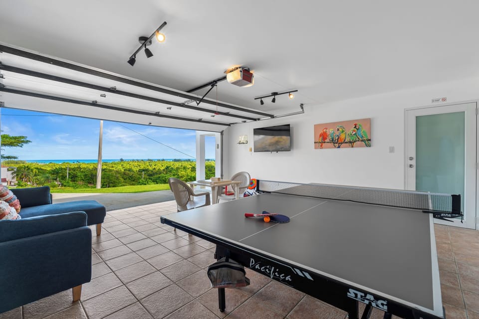 Play ping-pong with breezy tropical views in this open, sunny game room.