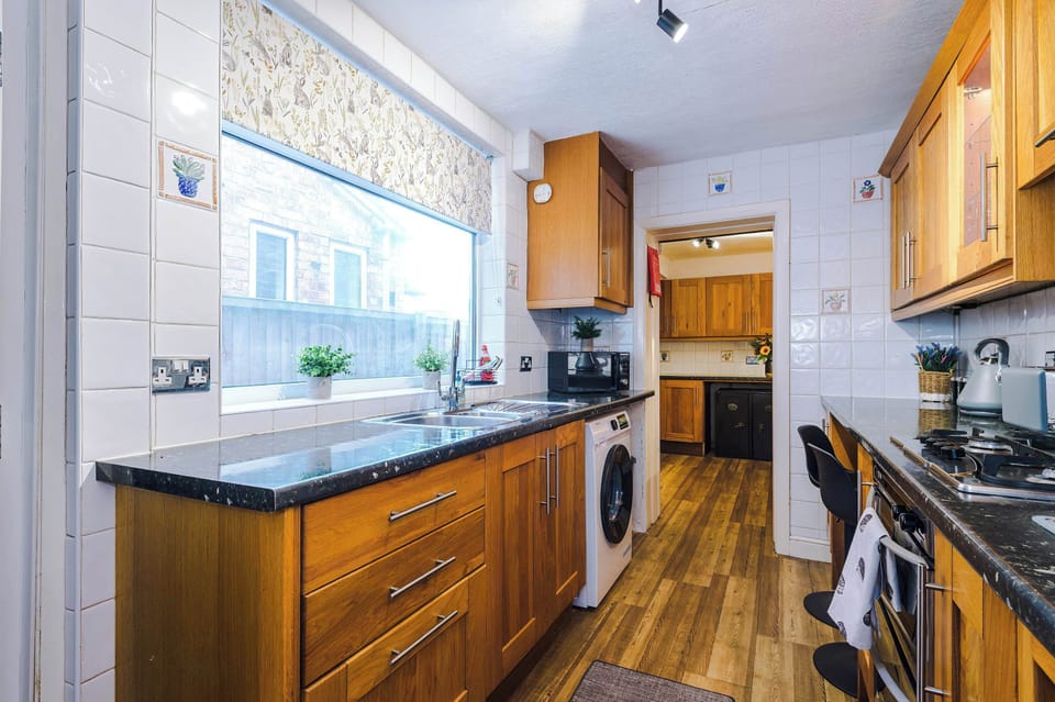 The long kitchen features a washing machine, oven, toaster, kettle and microwave and is fully equipped with everything you need to cook meals away from home. The original banking vaults are even still there for you to admire!
