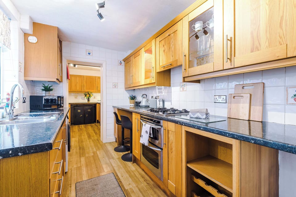 The long kitchen features a washing machine, oven, toaster, kettle and microwave and is fully equipped with everything you need to cook meals away from home. The original banking vaults are even still there for you to admire!