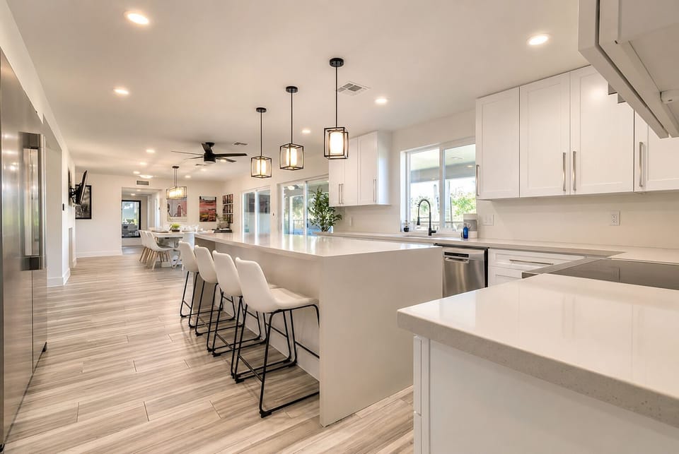 Beautiful new kitchen, quartz waterfall island with wine fridge.