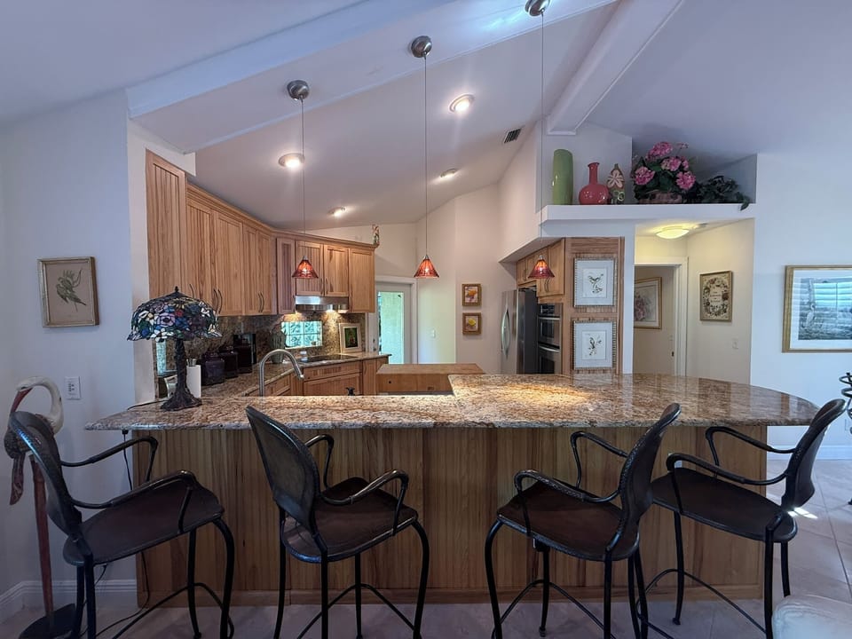 Gather around the bar and watch the chef!