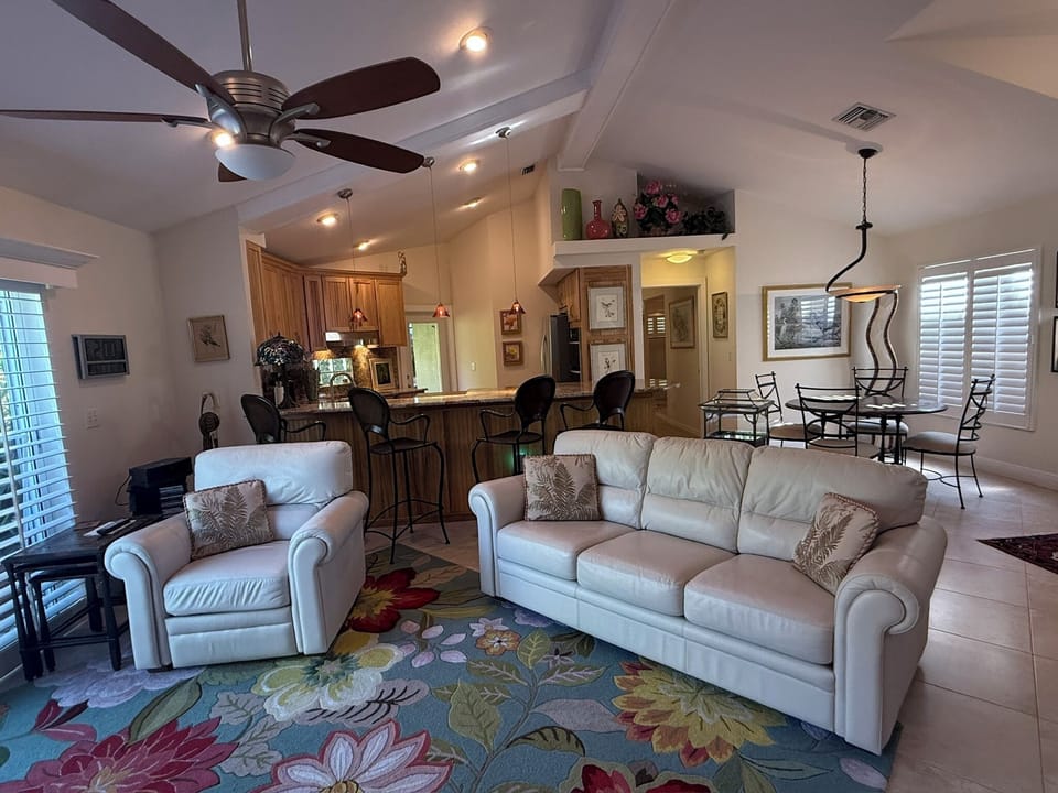 Great Room with 2 Recliner Chairs, Bar, Sofa, open to Kitchen and Dining Area