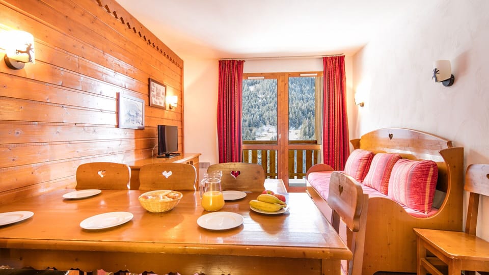 Spacious and welcoming lounge-dining space, designed in authentic Savoyard style with mountain views.