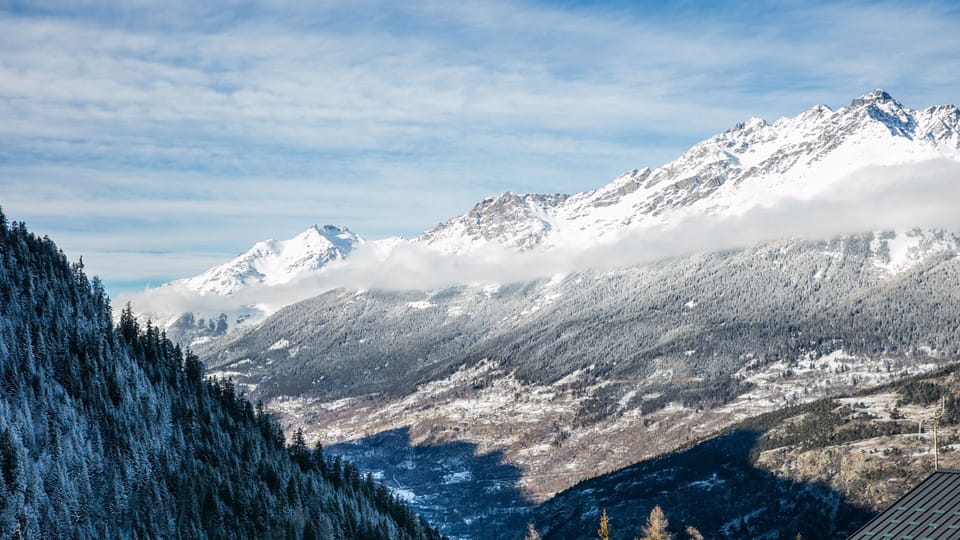Breathe in the crisp mountain air while soaking in the stunning views of snow-capped peaks.