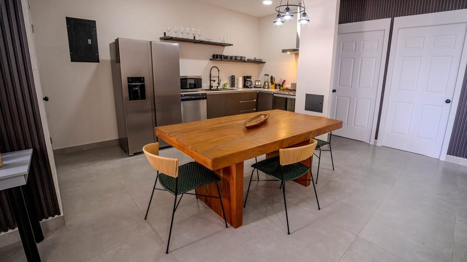Dine and unwind where the wood table meets the chef's kitchen of this Pedasí cabin.