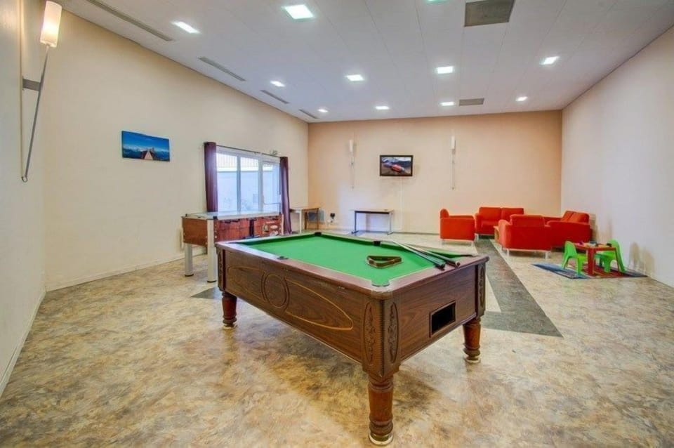 Shoot some pool with your group in the cozy billiards lounge.