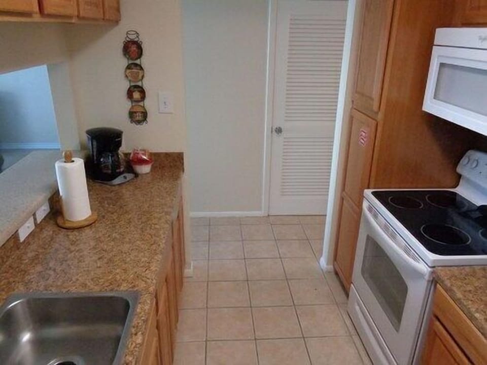 Warm kitchen nook where sunlight glows across the counters, capturing the essence of easy coastal living.