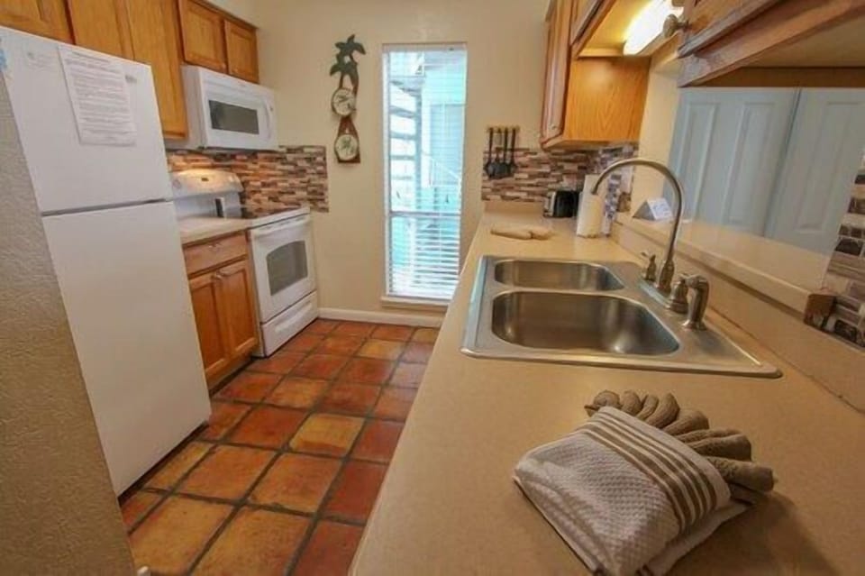Warm, welcoming kitchen with a touch of coastal charm, inspiring easy meals and shared laughter.