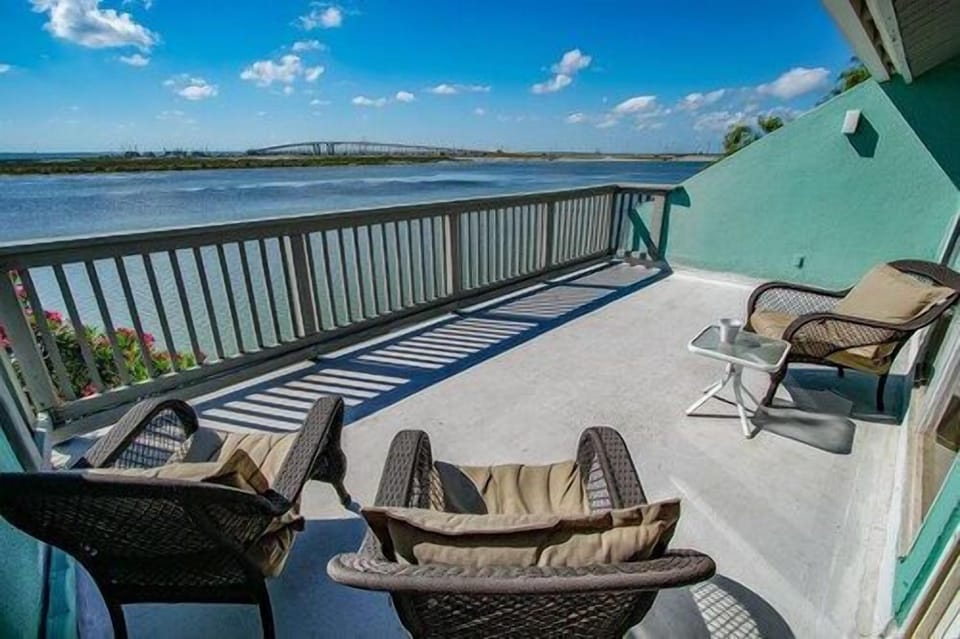 Expansive balcony overlooking the peaceful bay, where mornings begin with golden light and evenings fade into soft coastal hues.