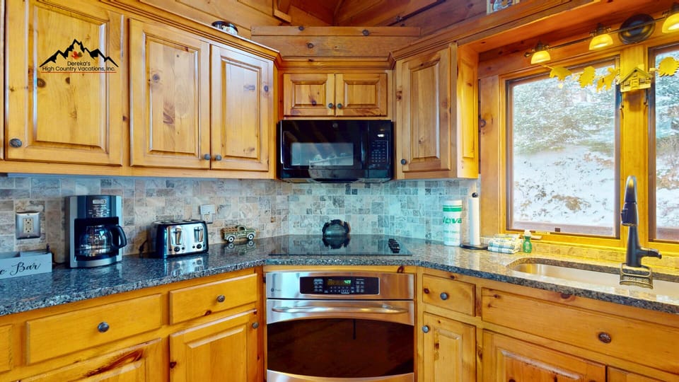 The open kitchen and dining layout keeps everyone connected while cooking, dining, or relaxing.