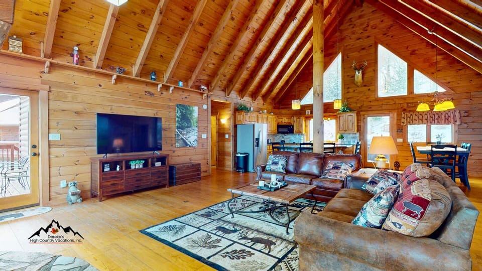 The open living area includes comfortable seating and a sleeper sofa for additional guest accommodations.