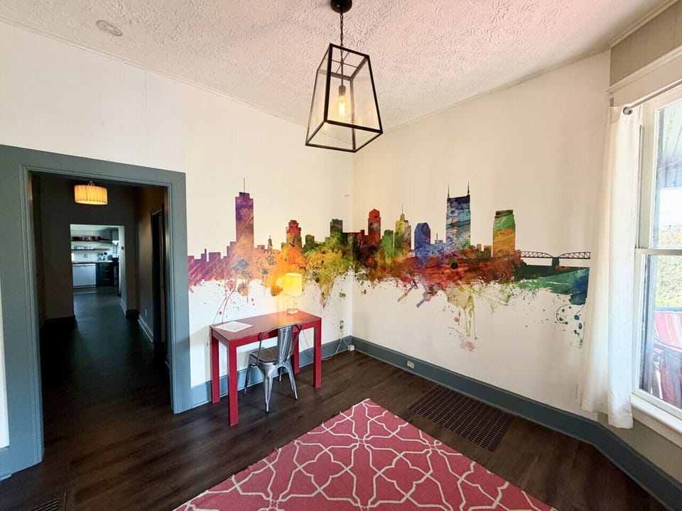 Throwback Nashville skyline mural—delightfully out of date.  And a desk for getting some work done.
