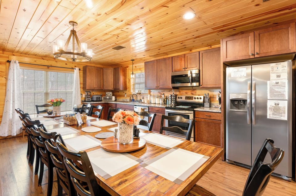 Rustic cabin kitchen with seating for 10 and stainless appliances