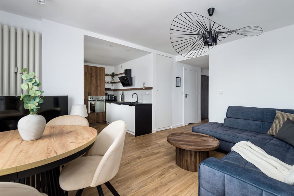 Deluxe Apartment, City View | Living area | 50-inch Smart TV with cable channels, offices
