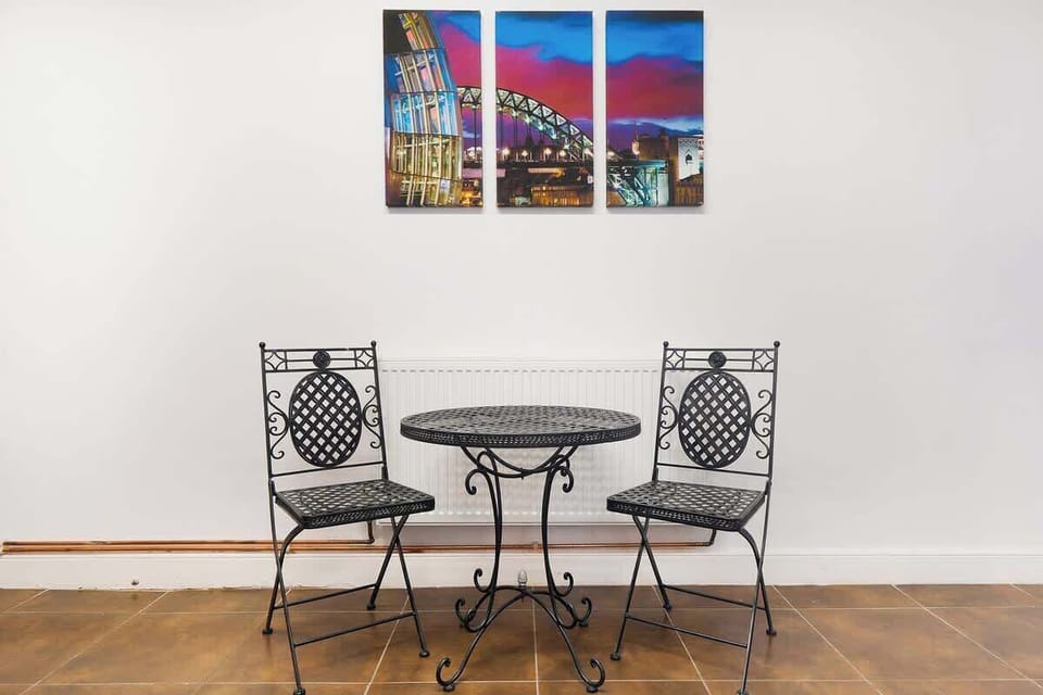 Kitchen equipped with all essentials, including an oven, fridge, and full cookware set.