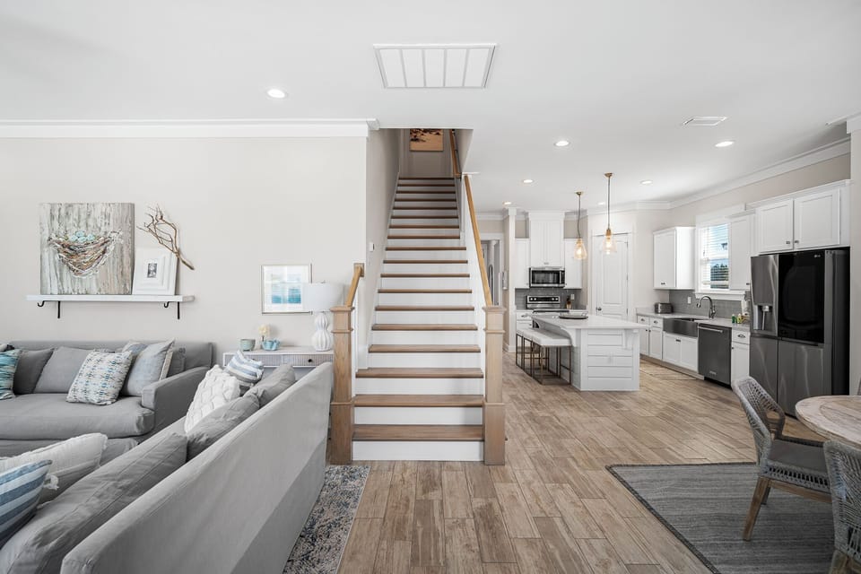 Bright coastal interiors, open layout—guests feel relaxed, stylish, & at home. 