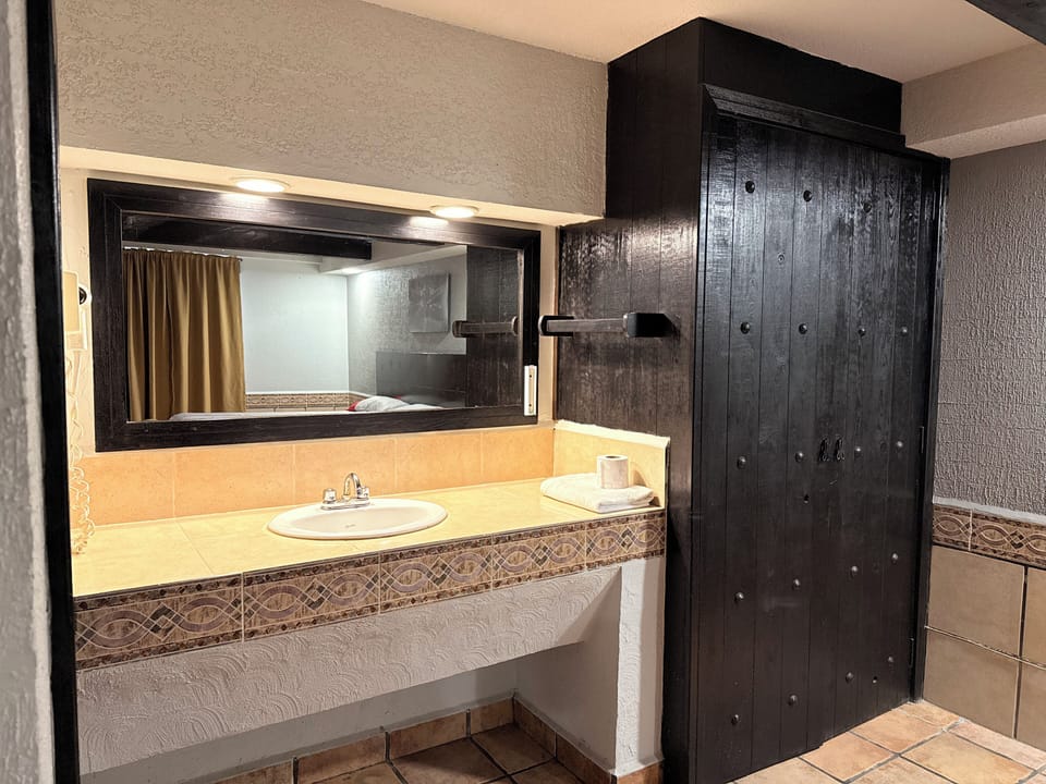 Separate tub and shower, towels, soap, shampoo