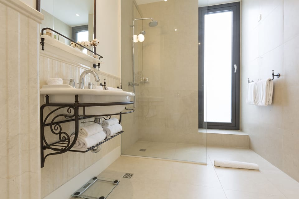 Executive Suite  | Bathroom | Shower, designer toiletries, hair dryer, bathrobes