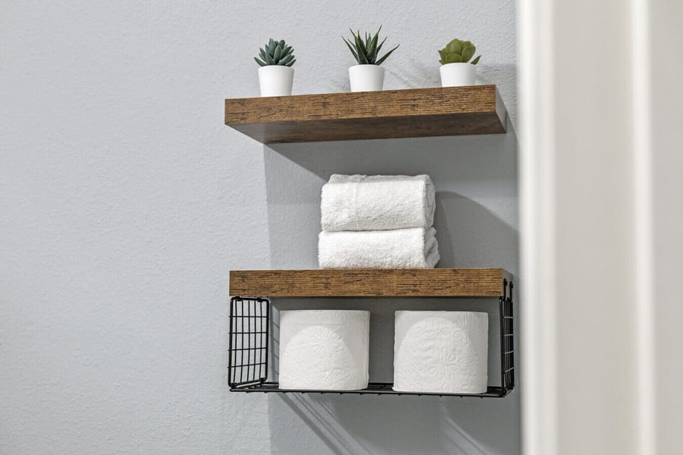 This space is stocked with fresh towels and extra toilet paper.