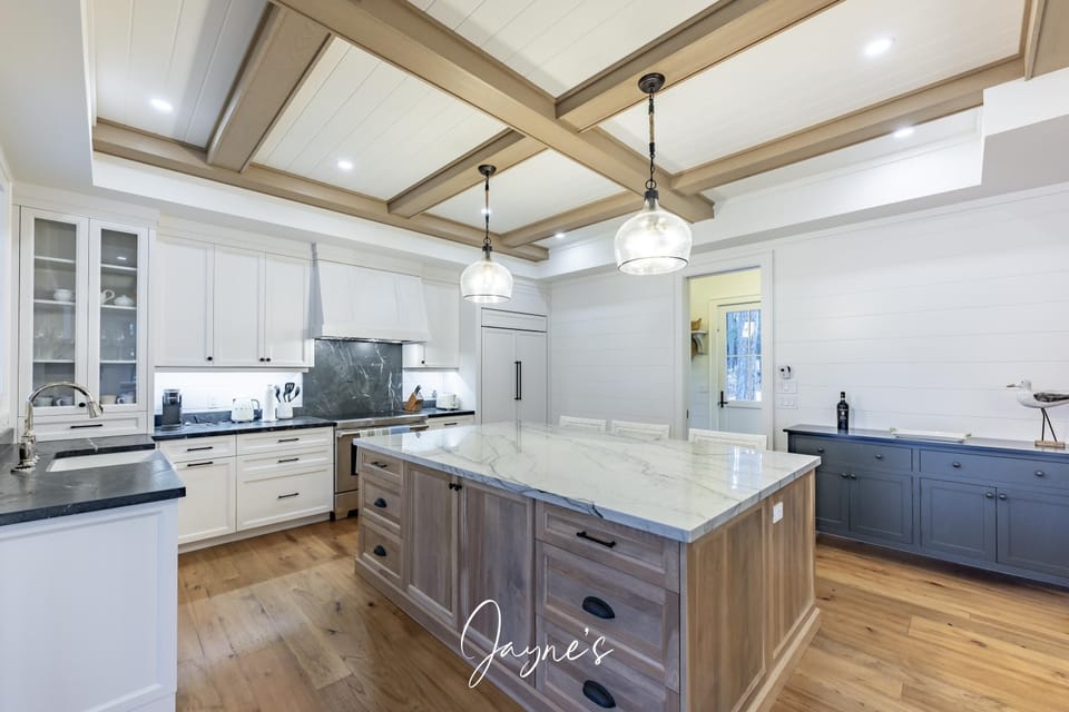 Spacious kitchen with elegant island and modern lighting