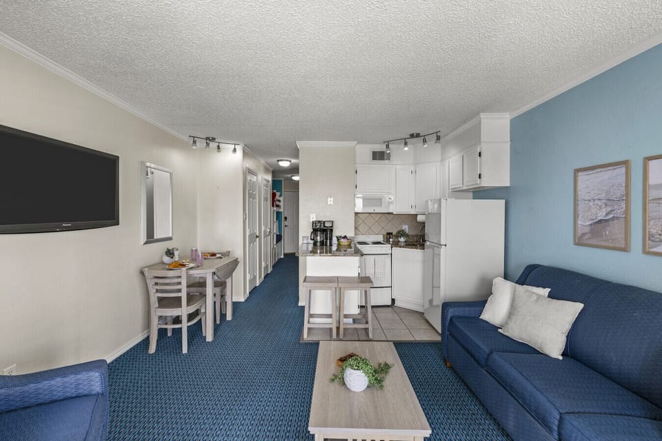 Open layout connecting living room, dining, and kitchen—designed for a comfortable, easy stay.