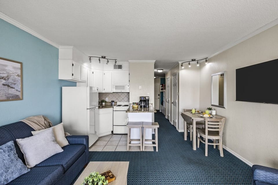 Full view of the condo layout, connecting living room, kitchen, and dining—perfect for a seamless and comfortable stay.