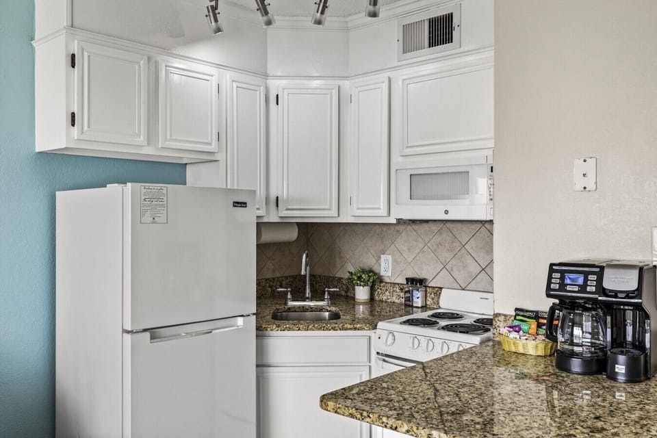 Clean and functional kitchen layout with plenty of counter space—ideal for quick breakfasts or family meals.