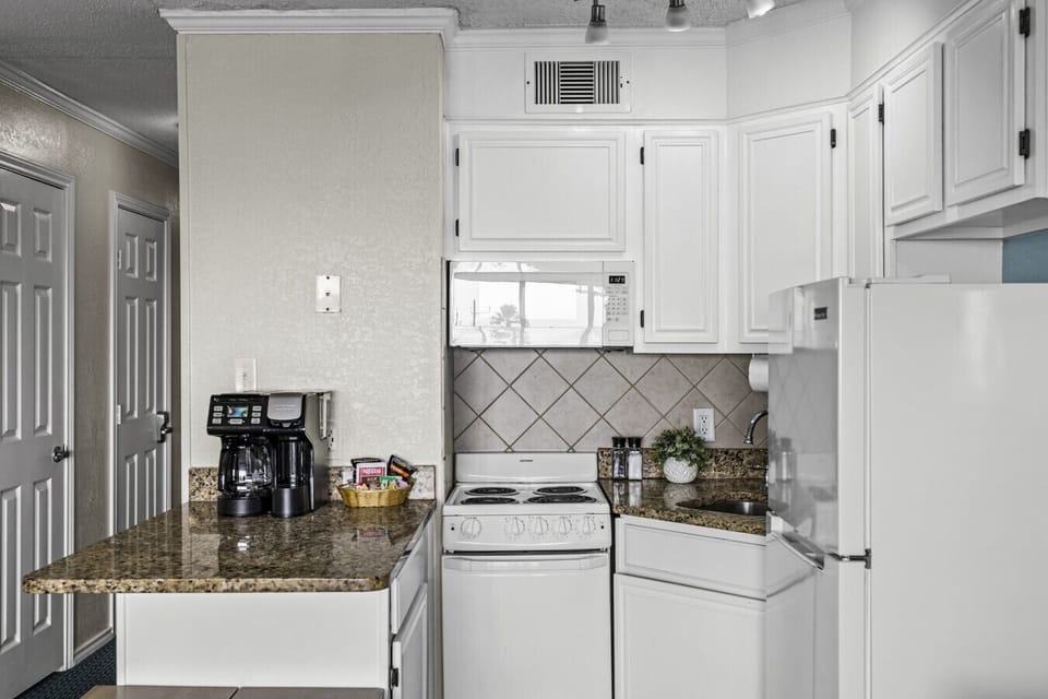 Fully equipped kitchen at Condo 335 with everything you need for easy meals during your stay