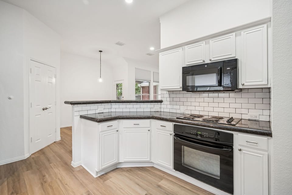Kitchen with breakfast bar area 