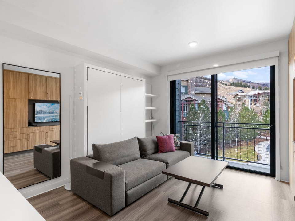 Studio living area with queen Murphy bed