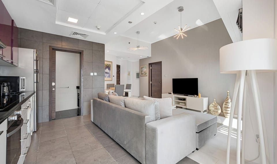 Deluxe Apartment, Sea View | Living area | TV